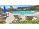 Community pool area with lounge seating, mature trees, and a pool house at 232 Decatur Dr, Summerville, SC 29486
