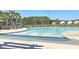 Large community pool with a zero entry and lounge chairs for relaxation at 232 Decatur Dr, Summerville, SC 29486