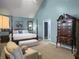 Bright and airy bedroom features a four-poster bed, comfortable seating, and a tall dresser at 2419 Tuscany Dr, North Charleston, SC 29406