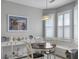 Bright breakfast nook features wood table and seating area with built-in bench at 2419 Tuscany Dr, North Charleston, SC 29406