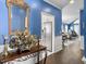 Inviting entryway showcasing hardwood floors, elegant decor, and a view into the bright living room at 2419 Tuscany Dr, North Charleston, SC 29406