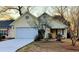 Charming one-story home featuring a two-car garage, lovely landscaping, and inviting front porch at 2419 Tuscany Dr, North Charleston, SC 29406