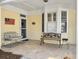 Inviting front porch with comfortable seating, decorative benches, and a 'Welcome' sign at 2419 Tuscany Dr, North Charleston, SC 29406