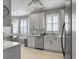 Modern eat-in kitchen with bright white cabinets, stainless steel appliances, and wood floors at 2419 Tuscany Dr, North Charleston, SC 29406