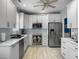 Modern kitchen with stainless steel appliances, white cabinets, and stylish countertops at 2419 Tuscany Dr, North Charleston, SC 29406