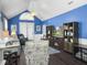 Bright living room with vaulted ceiling, ceiling fan, and open access to the backyard at 2419 Tuscany Dr, North Charleston, SC 29406