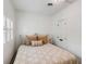 Cozy bedroom features neutral bedding, white walls, and double door closet at 25 Logan St, Charleston, SC 29401