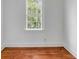 Bright bedroom with a large window offering a view of the trees at 25 Logan St, Charleston, SC 29401