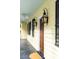 Inviting exterior view of the home featuring decorative lanterns and black shutters at 25 Logan St, Charleston, SC 29401