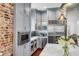 Chef's kitchen with marble countertops, stainless steel fridge, and a microwave at 25 Logan St, Charleston, SC 29401