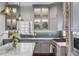 Stylish kitchen with marble countertops, stainless steel sink, and custom cabinets at 25 Logan St, Charleston, SC 29401