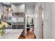 Bright open kitchen featuring marble countertops, stainless steel appliances, and hardwood floors at 25 Logan St, Charleston, SC 29401