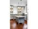 Stylish kitchen featuring a marble island, stainless steel appliances, and gray cabinets at 25 Logan St, Charleston, SC 29401