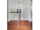 Upper hallway with hardwood floors and stained glass window at 25 Logan St, Charleston, SC 29401
