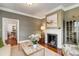 Cozy living room featuring a fireplace, hardwood floors, and stylish decor at 25 Logan St, Charleston, SC 29401