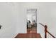 View from hallway into living room, with neutral sofa and hardwood floors at 25 Logan St, Charleston, SC 29401