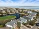 Beautiful aerial view of luxury waterfront homes, a golf course, and the ocean at 27 Ocean Point Dr, Isle of Palms, SC 29451