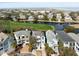 Aerial view of waterfront homes with scenic views of the golf course and the marsh at 27 Ocean Point Dr, Isle of Palms, SC 29451