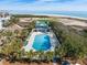 Overhead view of a community pool and clubhouse next to the beach and golf course at 27 Ocean Point Dr, Isle of Palms, SC 29451
