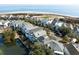 Overhead shot of luxury homes near a beach, golf course, and waterfront at 27 Ocean Point Dr, Isle of Palms, SC 29451