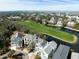 Scenic aerial view of a waterfront community featuring lush green spaces and a golf course at 27 Ocean Point Dr, Isle of Palms, SC 29451