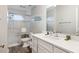Well-lit bathroom with a walk-in shower, white vanity with quartz countertop, and modern fixtures at 27 Ocean Point Dr, Isle of Palms, SC 29451