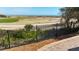 Picturesque golf course view from the outdoor patio, featuring a manicured green and ocean backdrop at 27 Ocean Point Dr, Isle of Palms, SC 29451
