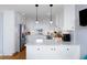 Bright kitchen with quartz countertops, stainless steel appliances, and white cabinets at 27 Ocean Point Dr, Isle of Palms, SC 29451