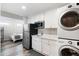 Compact kitchenette with appliances and white cabinetry, perfect for a guest suite at 27 Ocean Point Dr, Isle of Palms, SC 29451