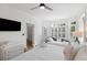 Bright main bedroom featuring a king bed, daybed, bay window, and coastal decor at 27 Ocean Point Dr, Isle of Palms, SC 29451