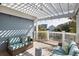 Cozy covered porch with comfortable seating and serene views of the neighborhood at 27 Ocean Point Dr, Isle of Palms, SC 29451