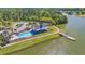 Beautiful community pool with lounge chairs, clubhouse, pier, and lake at 3213 Great Egret Dr, Johns Island, SC 29455