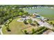 Aerial view of community pool, lake, parking, and dog park with beautiful homes at 3213 Great Egret Dr, Johns Island, SC 29455