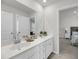 A bathroom with a double vanity and two doors leading to the main bedroom and closet at 3213 Great Egret Dr, Johns Island, SC 29455