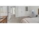 Comfortable bedroom with neutral walls and a view of the open layout of the home at 3213 Great Egret Dr, Johns Island, SC 29455