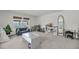 Spacious bonus room featuring plush seating, a play area, neutral carpet and bright natural light at 3213 Great Egret Dr, Johns Island, SC 29455