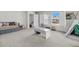 Bright bonus room with large windows, neutral carpet, and a play area, perfect for Gathering fun at 3213 Great Egret Dr, Johns Island, SC 29455