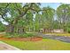 Picturesque entrance to Saint John's Lake with lush landscaping at 3213 Great Egret Dr, Johns Island, SC 29455