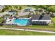 Beautiful community pool with lounge chairs and clubhouse overlooking green lawns at 3213 Great Egret Dr, Johns Island, SC 29455