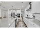 Well-equipped kitchen with a large island, stainless appliances, and sleek white cabinets at 3213 Great Egret Dr, Johns Island, SC 29455