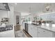 Open-concept kitchen featuring a large island, pendant lighting, and views into the adjacent living area at 3213 Great Egret Dr, Johns Island, SC 29455