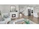 Well-lit living area featuring a fireplace and view to the kitchen at 3213 Great Egret Dr, Johns Island, SC 29455