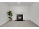 Cozy living room showcases a modern fireplace with black trim and a decorative plant at 3213 Great Egret Dr, Johns Island, SC 29455