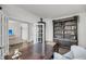 Well-appointed home office with a large desk, custom shelving, and access to the living area at 3213 Great Egret Dr, Johns Island, SC 29455