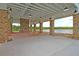 Spacious outdoor pavilion with brick columns, a large fireplace, and water views at 3213 Great Egret Dr, Johns Island, SC 29455