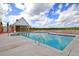 Modern community pool with bathhouse, zero entry point, and beautiful clear water on a sunny day at 3213 Great Egret Dr, Johns Island, SC 29455