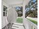 Cozy porch featuring a hanging wicker chair with a view of the neighborhood at 3213 Great Egret Dr, Johns Island, SC 29455