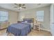 A bedroom featuring hardwood floors, two nightstands, and a bed with a dark blue comforter at 501 E Richardson Ave, Summerville, SC 29485