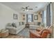 Comfortable living room featuring cozy seating, a ceiling fan, and stylish decor at 501 E Richardson Ave, Summerville, SC 29485