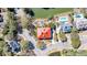 Aerial view of a charming house with a bright red roof, a pool and waterfront access at 547 Island Walk, Mount Pleasant, SC 29464